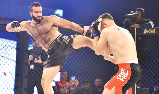 Saudi fighter battles through broken rib to triumph at MMA event