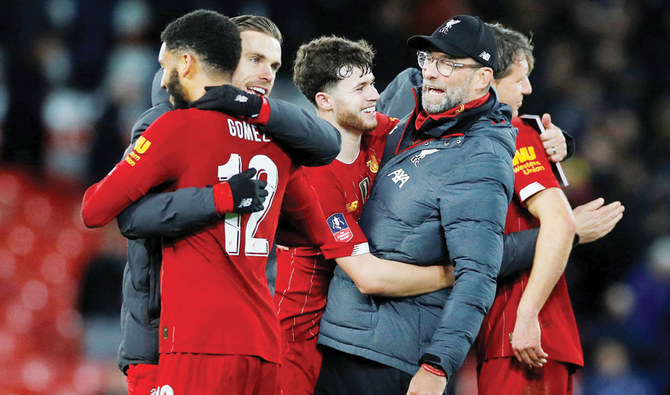 Liverpool march toward  history as top-four race heats up