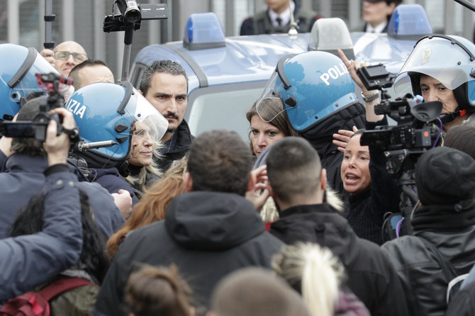 Convicts on roof, fatalities as Italy jails protest virus
