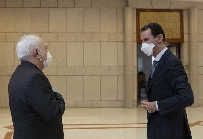 Wearing face masks, Syria’s Assad and Iran’s Zarif condemn West at Damascus meeting