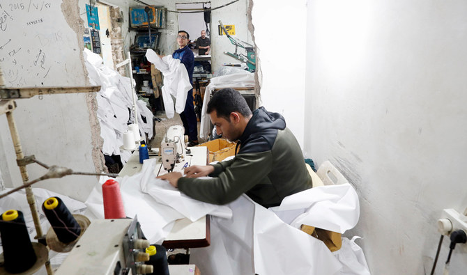 Gaza factories back to work making protective wear