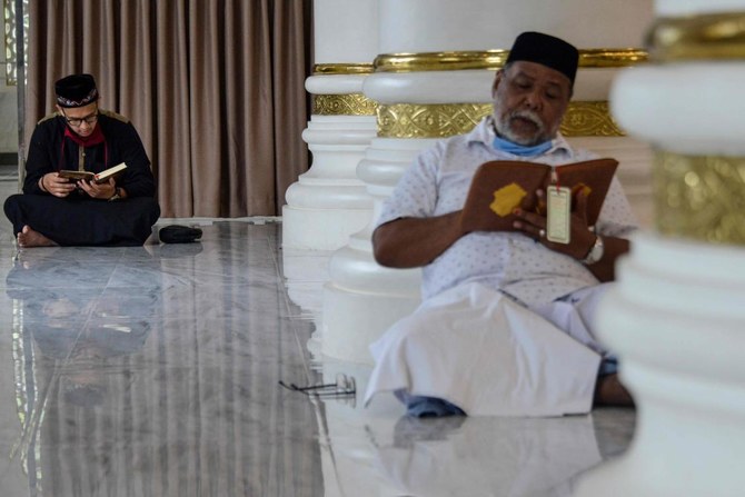 In Aceh, Indonesians pray at mosque during COVID-19 Ramadan, but bring own rugs