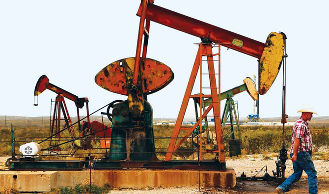 Oil up on weak dollar though US-China tensions weigh
