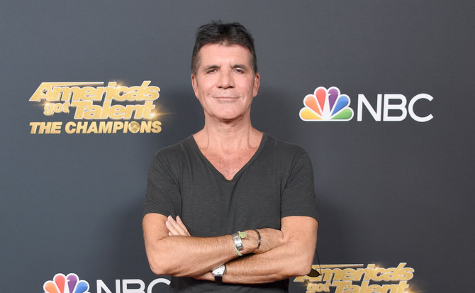 Simon Cowell returns home after back surgery 