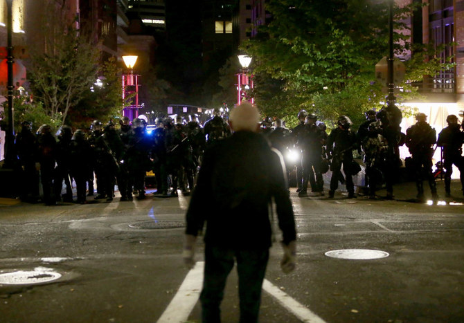 Portland police declare riot, push protesters from building