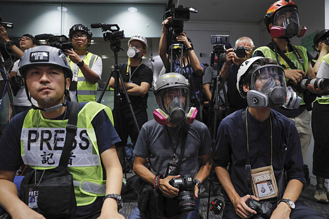 Hong Kong journalists protest new accreditation rules