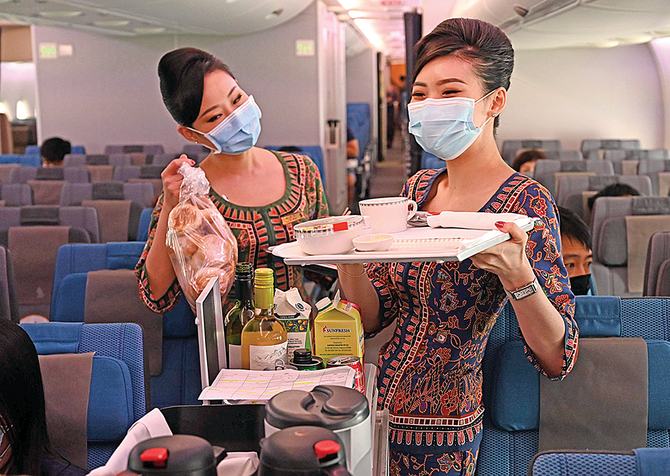 Hundreds of travel-starved ‘passengers’ dine on parked planes of Singapore Airlines