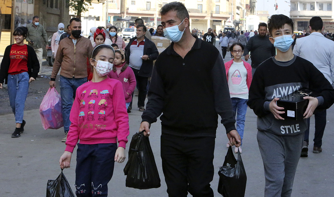 Iraqis shed masks as economic pain overshadows coronavirus fear