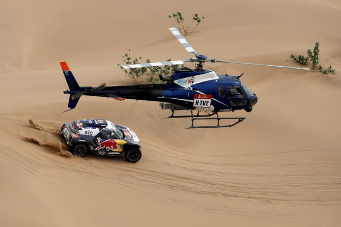 X-Raid Mini JCW Team’s Stephane Peterhansel and Co-Driver Edouard Boulanger in action during stage 11 of the Dakar Rally. (Reuters)