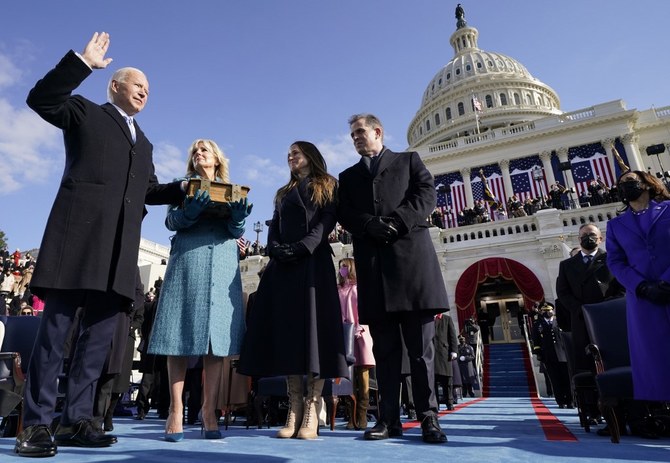 Joe Biden is sworn in as the 46th President of the United States as his spouse Jill Biden holds a bible on the West Front of the US Capitol in Washington DC, January 20, 2021. (AFP)