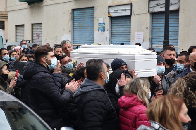 Pallbearers carry the casket during the funeral ceremony for a 10-year-old girl who died while participating in a so-called "blackout" challenge while using TikTok social network, in Palermo, Italy, onJan. 26, 2021. (Alberto Lobianco/LaPresse via AP)