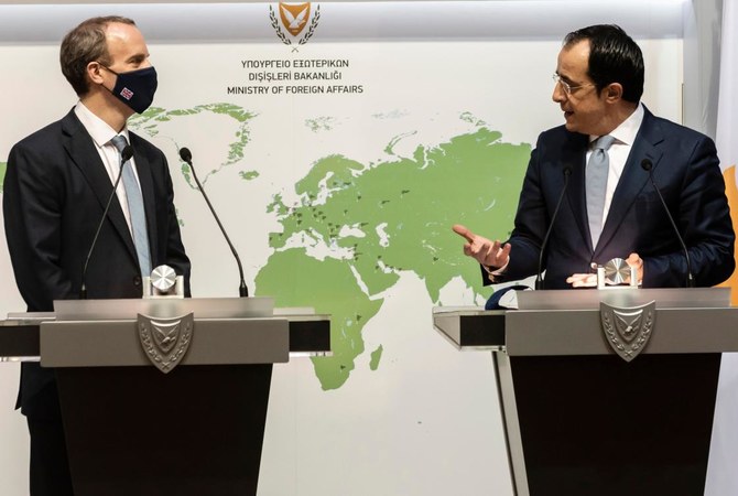 British Minister of Foreign Affairs, Dominic Raab (L), listens to his Cypriot counterpart Nikos Christodoulides during a joint press conference after their meeting in the capital Nicosia, on February 4, 2021. (AFP)