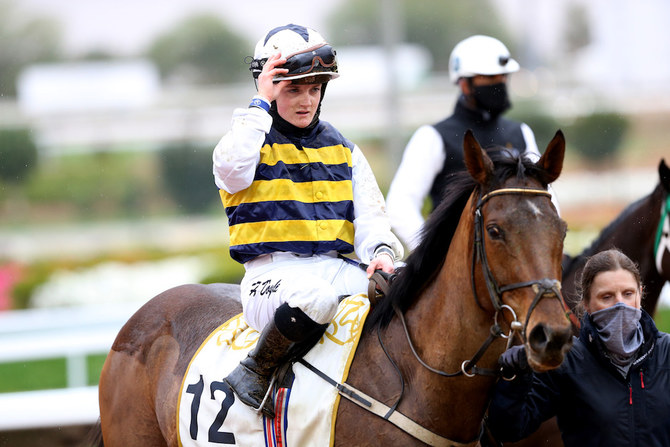 Hollie Doyle made history on Saturday by becoming the first female jockey to win a race on Saudi Cup day. (Reuters)