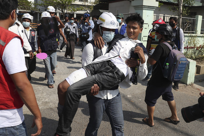 A wounded protester is carried during a protest against the military coup in Mandalay, Myanmar, Sunday, Feb. 28, 2021. (AP)