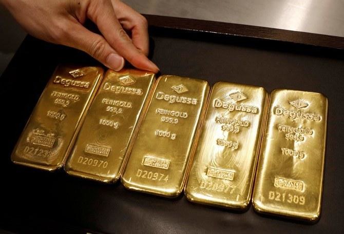 Gold rises 1% on weaker dollar, US stimulus cheer