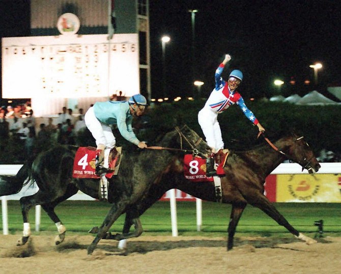 US jockey Jerry Bailey (R) riding "Cigar" celebrates on the finish line 27 March 1996 in Dubai after winning the Dubai World Cup. (AFP/File Photo)