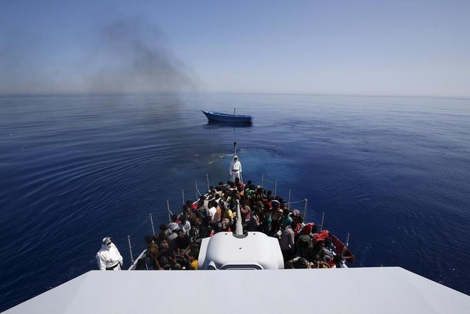 A group of 300 Africans sit in board at Italian Finance Police vessel Di Bartolo as their boat is left to adrift off the coast of Sicily. (Reuters/File Photo)