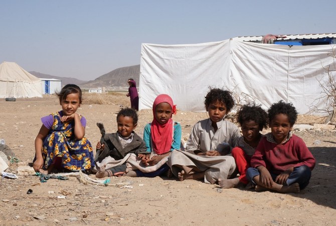 Yemeni children sit at the Jaw Al-Naseem camp for internally displaced people on the outskirts of the northern city of Marib, on February 18, 2021. (AFP/File Photo)