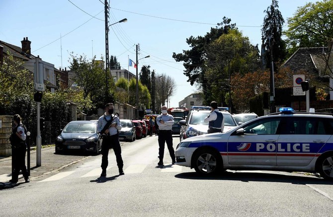 Attacker fatally stabs police employee near Paris, Macron calls it terrorism