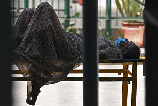 A Covid-19 coronavirus patient lies on a stretcher outside a hospital in New Delhi on April 24, 2021. (AFP)