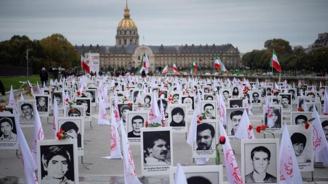 The 1988 executions of thousands of Iranian political prisoners were commemorated by representatives of the People's Mujahedin of Iran in France in 2019. (AFP/File Photo)