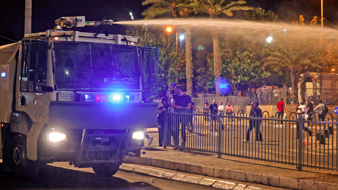 Palestinian protesters and Israeli security forces clash, water cannon deployed