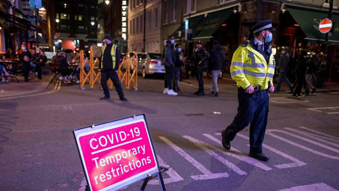 UK police issue terror warning as crowds return post-lockdown