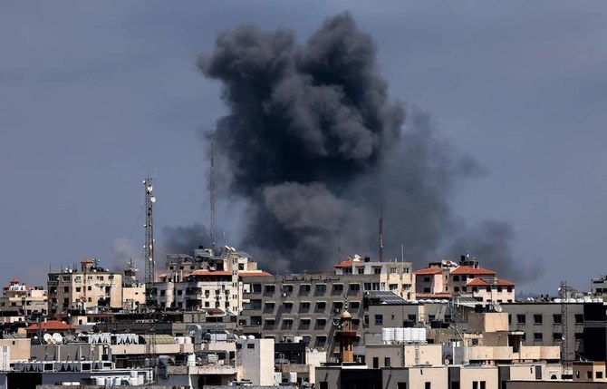 Smoke billows following Israeli airstrikes on Gaza City on May 12, 2021, amid the most intense Israeli-Palestinian hostilities in seven years, which have so far killed at least 45 Palestinians, including 13 children, and five Israelis. (AFP)