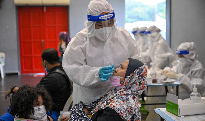 Calls for strict lockdown in Malaysia as COVID-19 cases hit record highs