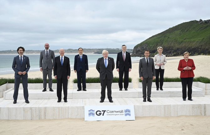 British Prime Minister Boris Johnson greeted world leaders on a wooden boardwalk atop the freshly raked sand of Carbis Bay to open the Group of Seven summit Friday. (AP)