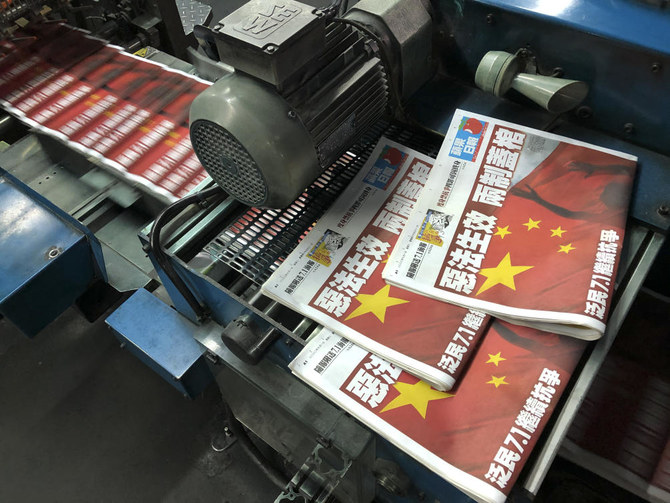 Hong Kong media reel as security law targets democracy paper’s reporting