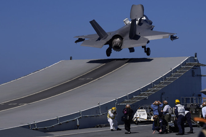 An F-35 aircraft takes off from the UK's aircraft carrier HMS Queen Elizabeth in the Mediterranean Sea on June 20, 2021. (AP Photo/Petros Karadjias)