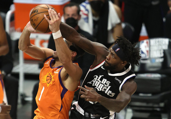 LA Clippers' Patrick Beverley knocks the ball from the hands of Suns' Devin Booker during Game 3 of the NBA West finals on June 24, 2021. (Sean M. Haffey/Getty Images/AFP)