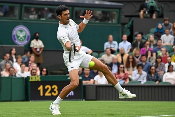 Djokovic slides to victory as Wimbledon makes soggy return