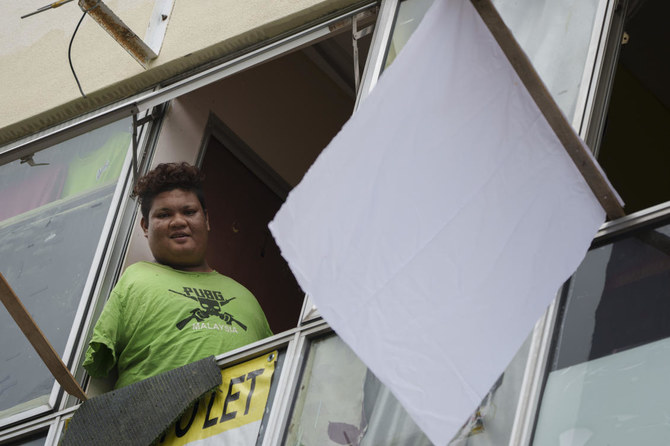 Malaysians suffering amid coronavirus lockdown fly white flag for help