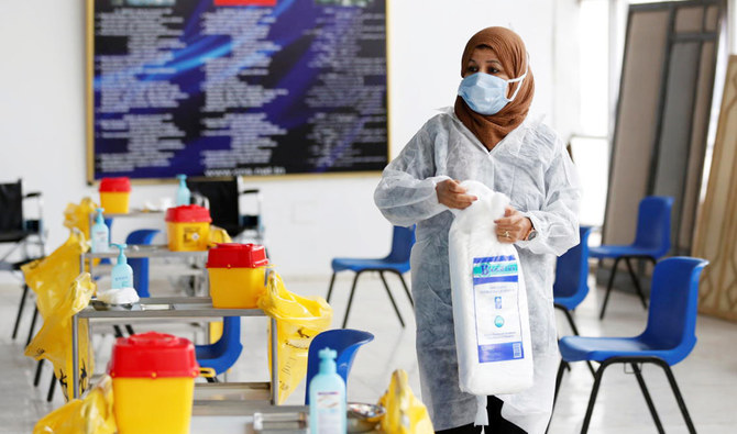 A health worker prepares to handle coronavirus vaccines in Tunisia. (Reuters/File)