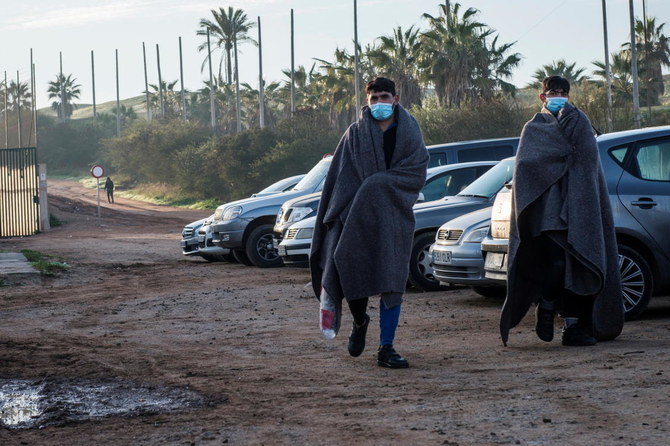 Dozens of migrants rush border into Spain’s Melilla enclave