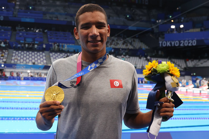 Gold medalist Ahmed Hafnaoui of Tunisia on the podium.(REUTERS/Kai Pfaffenbach)