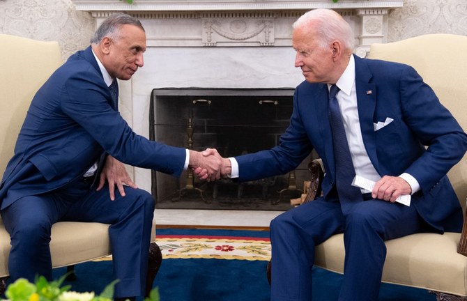US President Joe Biden shakes hands with Iraqi Prime Minister Mustafa Al-Kadhimi (L) in the Oval Office of the White House in Washington, DC, July 26, 2021. (AFP)