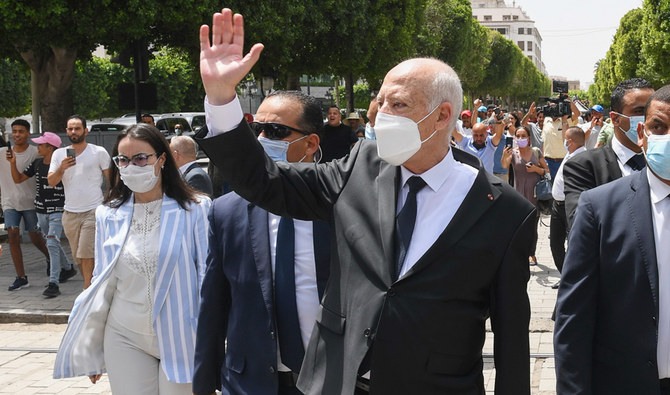 In this Sunday, Aug. 1, 2021 file photo, Tunisian President Kais Saied waves to bystanders as he strolls along the avenue Bourguiba in Tunis, Tunisia. (AP)
