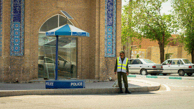 Police stand guards in Tehran, Iran. (Shutterstock)