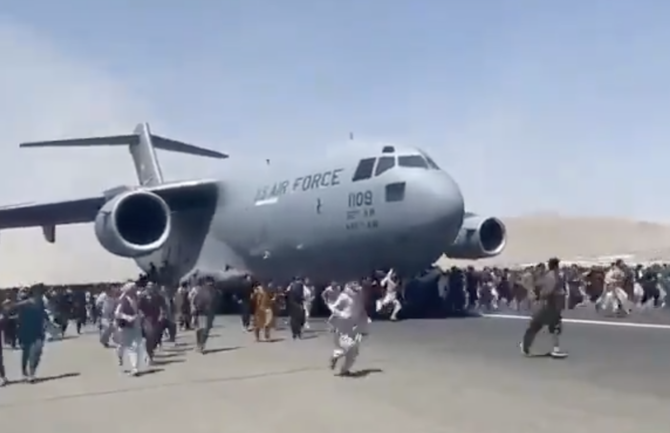 7 dead in airport mayhem as thousands flee Taliban takeover