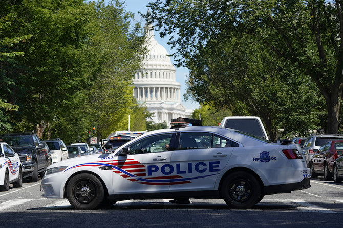 A Metropolitan Police Department cruiser blocks a street near the US Capitol and a Library of Congress building in Washington on Thursday, Aug. 19, 2021. (AP)