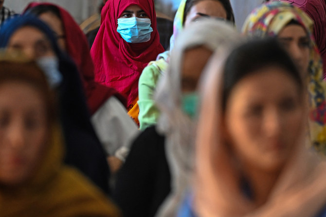 Afghan women take part in a gathering at a hall in Kabul on August 2, 2021 against the claimed human rights violations on women by the Taliban regime in Afghanistan. (AFP)