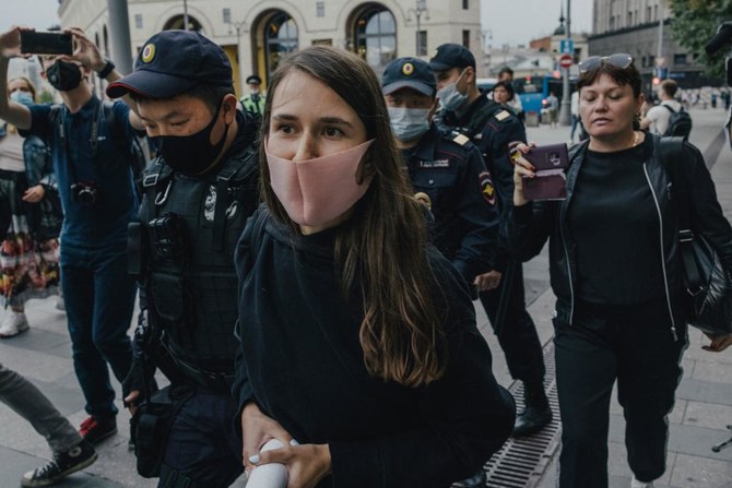 Journalist Sonya Groysman arrested in front of where she held a single picket in support of independent media, in Moscow. (The NY Times)