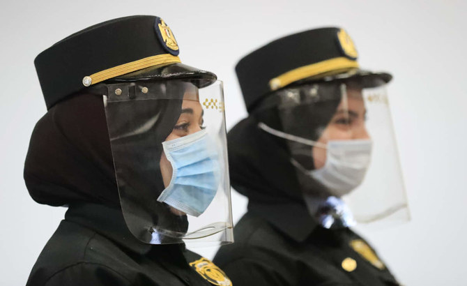 Egyptian policewomen, wearing protective face shields, stand at attention at the Sharm el-Sheikh international airport. (AFP file photo)