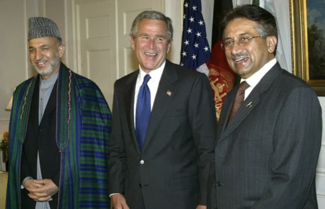 Afghanistan President Hamid Karzai (L), US President George W. Bush (C), and Pakistan President Pervez Musharaf (R) share a light moment with reporters 21 September 2004 at the Waldorf-Astoria Hotel in New York. (File/AFP)