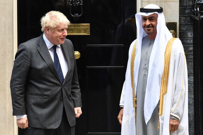 Britain's Prime Minister Boris Johnson (L) greets Crown Prince of Abu Dhabi, Mohamed bin Zayed Al Nahyan on his arrival at No. 10, Downing Street in central London, on September 16, 2021. (AFP)
