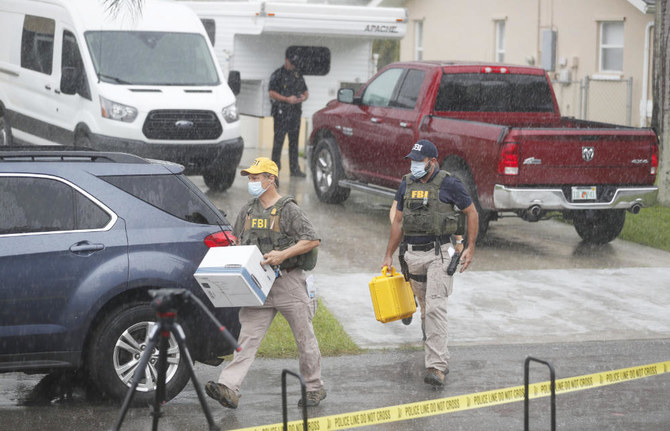 FBI agents begin to take away evidence from the family home of Brian Laundrie, who is a person of interest after his fiancé Gabby Petito went missing on September 20, 2021 in North Port, Florida. (AFP)
