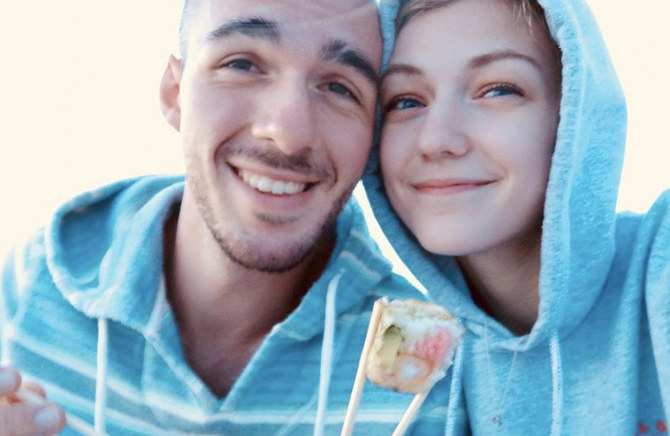 Gabrielle Petito, 22, who was reported missing on Sept. 11, 2021 after traveling with her boyfriend around the country in a van and never returned home, poses for a photo with Brian Laundrie in this undated handout photo. (REUTERS)